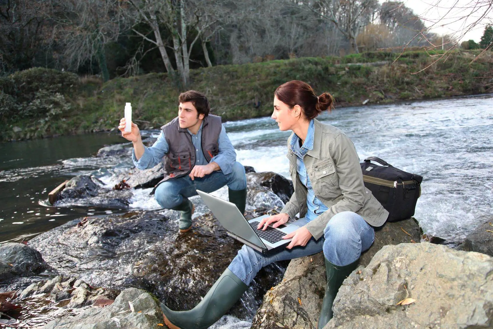 8972750 – biologists testing water of natural river Environmental Studies A.S.