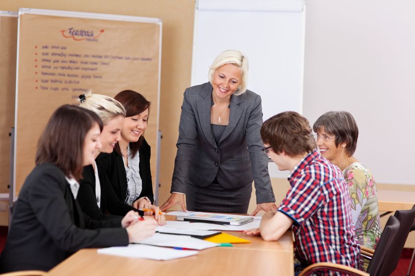 21375307 – a group of professional people having a meeting in conference room 100 Women Campaign