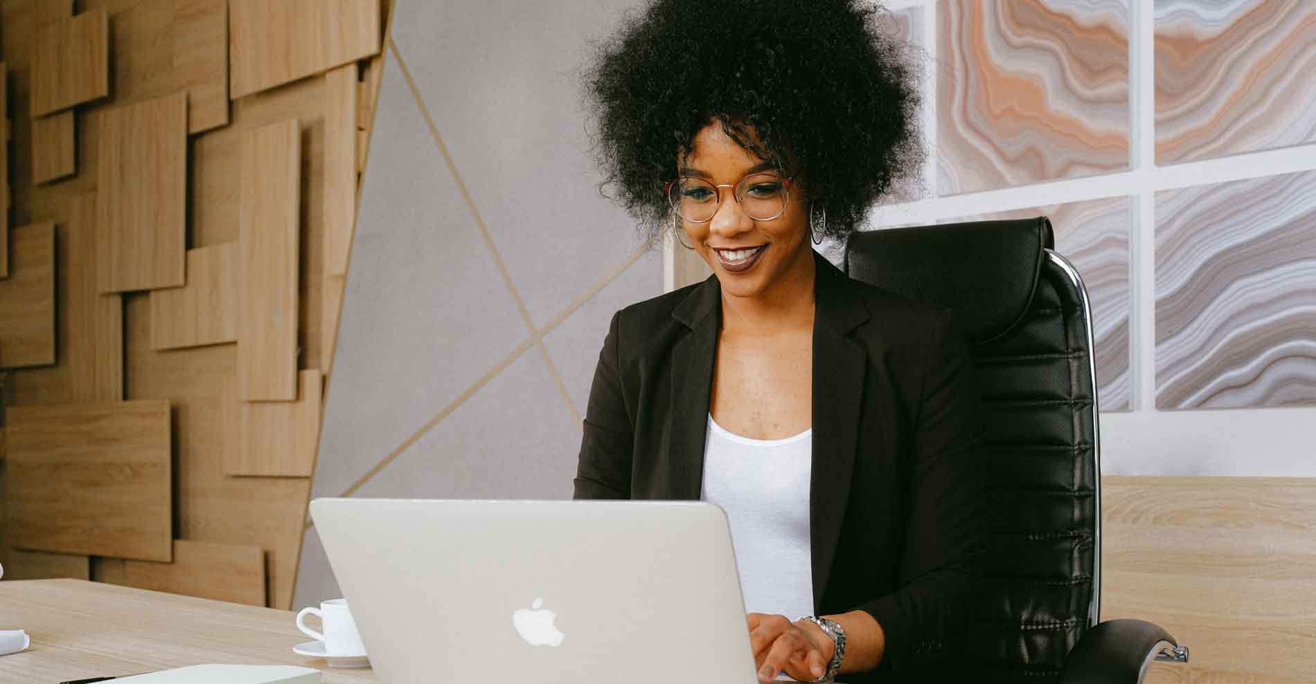 business-woman woman in suit working on laptop