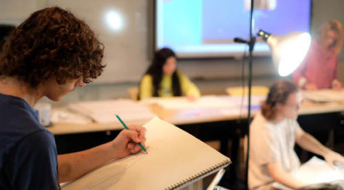Students-Drawing,-Basic-Drawing-(3) students working in a drawing class using sketch pads