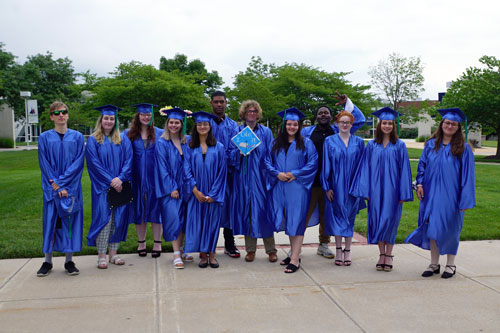 group photo of the students in cap and gowns graduating from the Ocean Achievement center