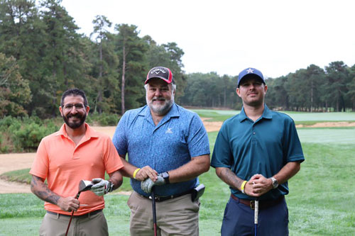 trio of men at golfing at the 20th annual foundation golf outing