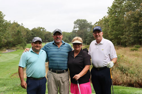 Four Ocean First golfers at the O.C.C. foundation golf classic