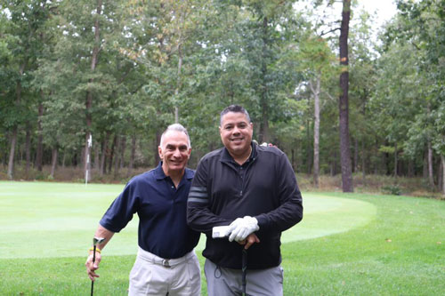 Ralph Aponte and guest at the 20th annual O.C.C. foundation golf classic