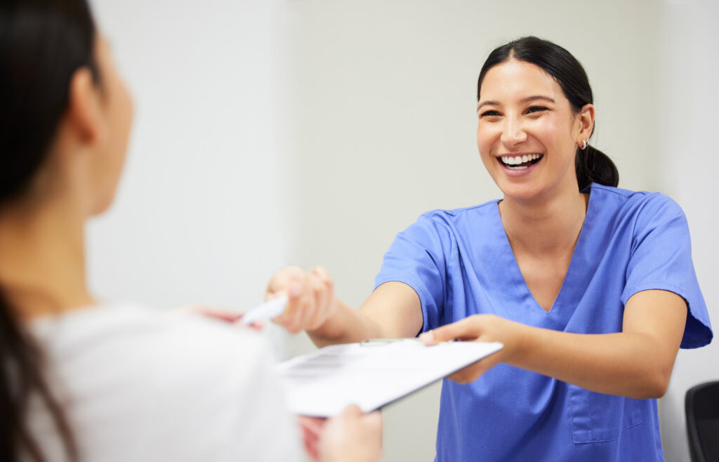 Clinical Medical Assistant CCMA Two dental workers engaging with each other