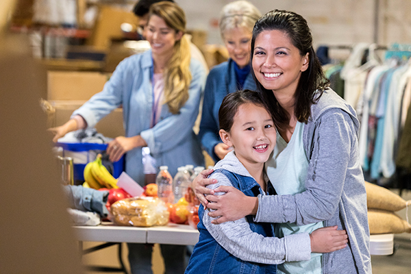 Social Work Foodbank Woman With Daughter