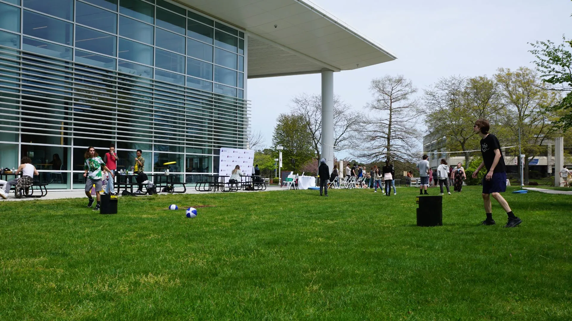 Students Playing Frisbee and Kanjam outside of the Student Center