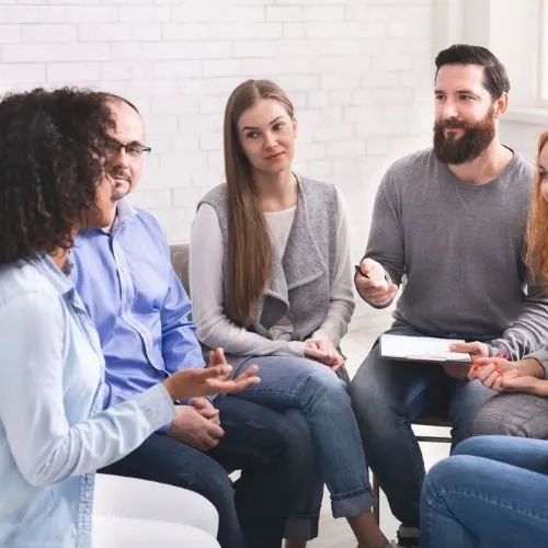 Students sitting in group therapy sessions