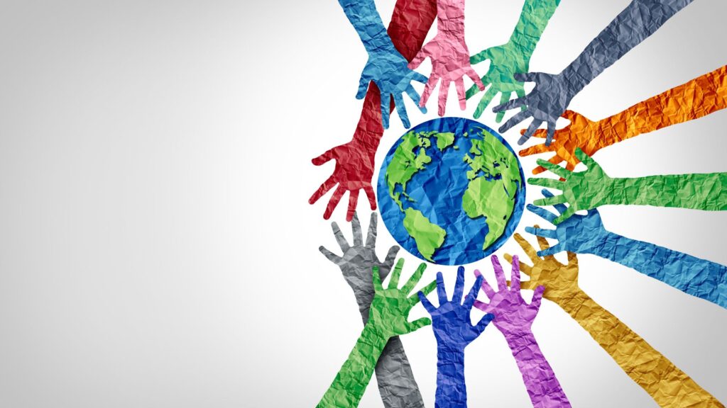 Rainbow hands reaching for the globe