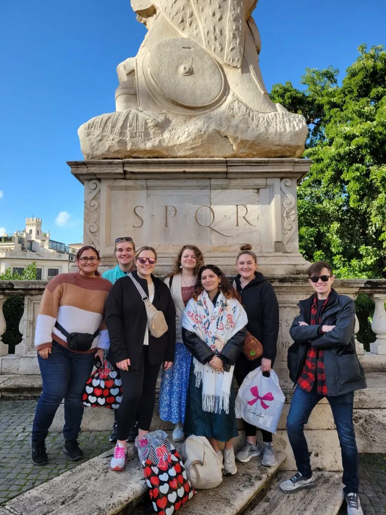 OCC History Students in front of outdoor statue