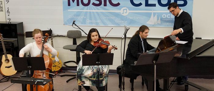 Music students and faculty playing instruments