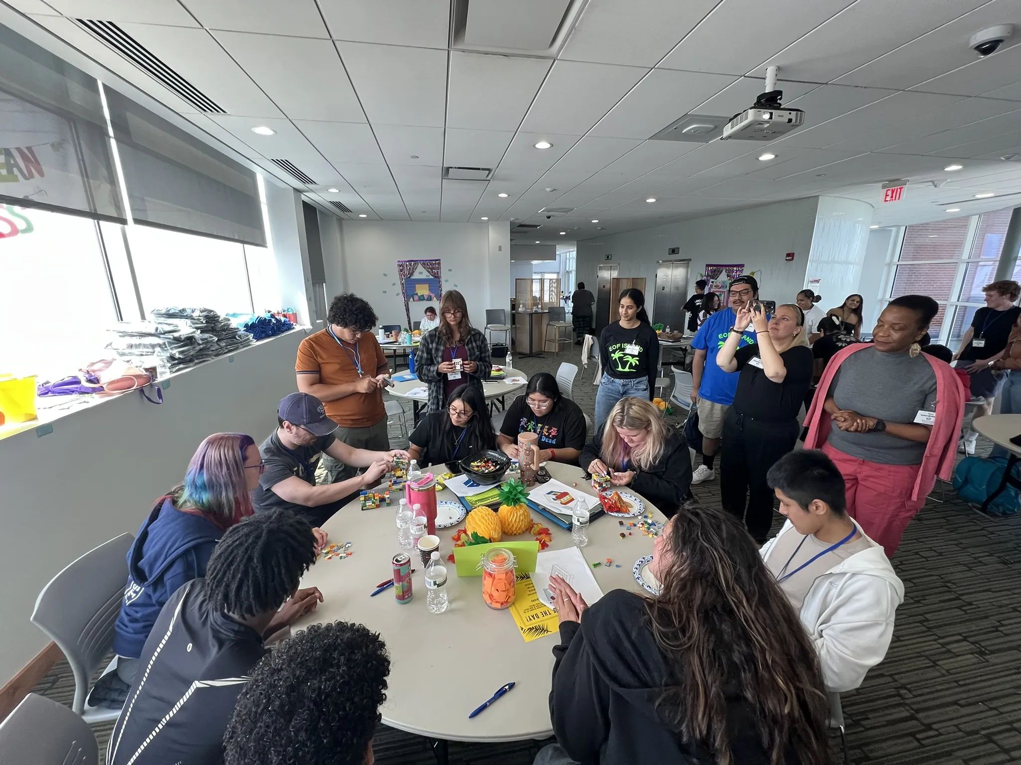 group of EOF students sitting at a table collaborating on a lego house 