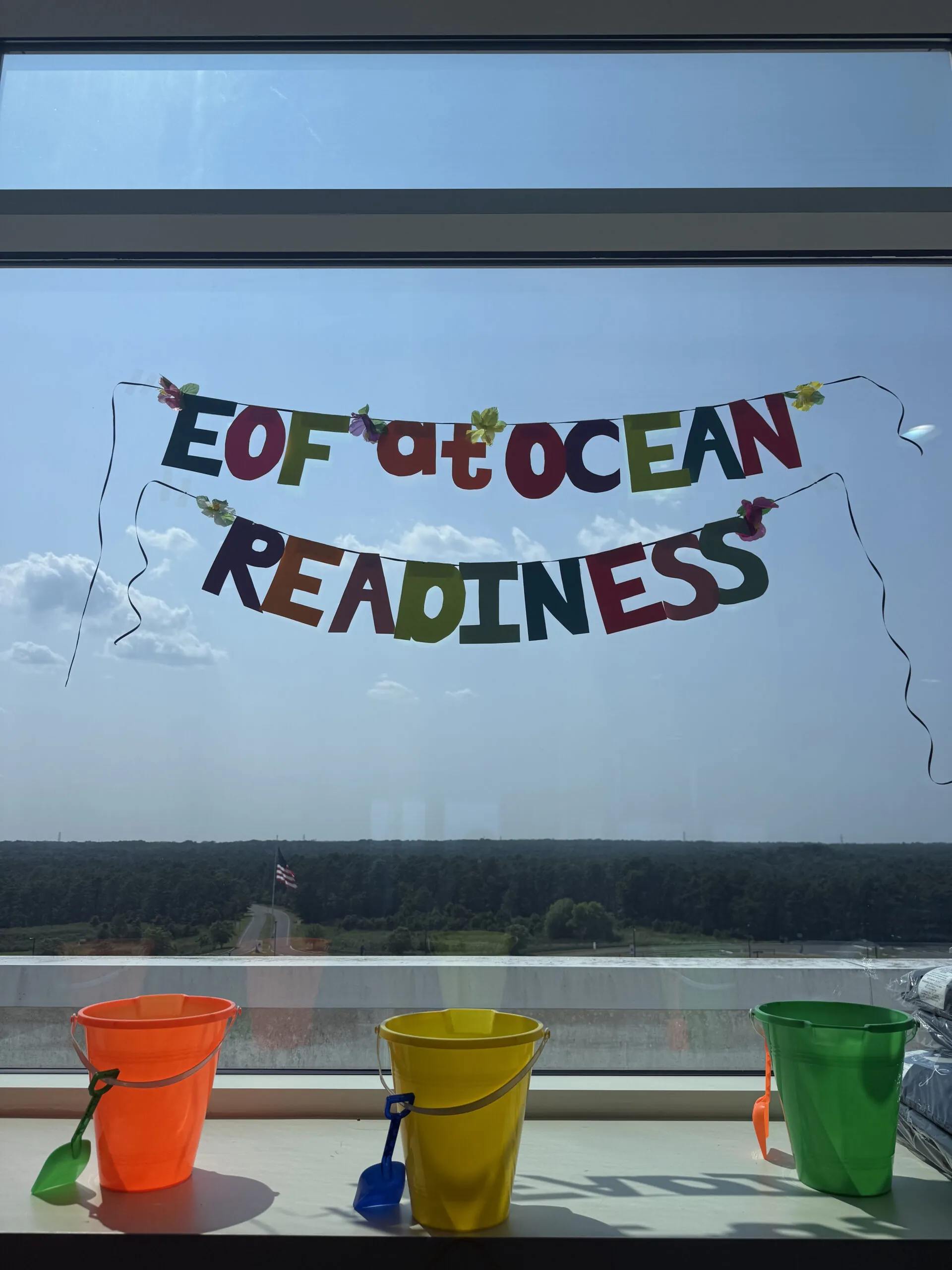 Banner hung in a window that says "EOF at Ocean Readiness"