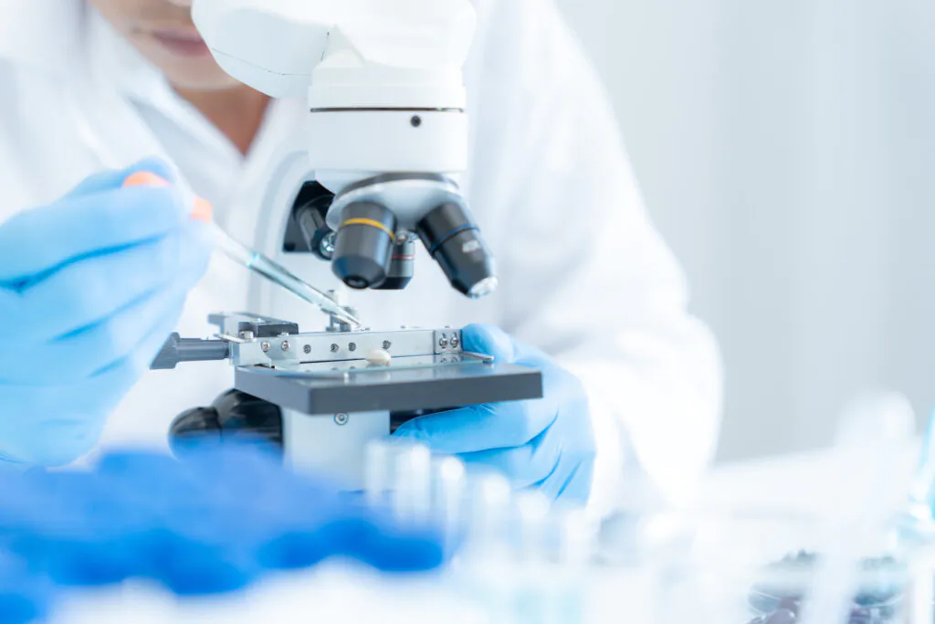 Scientist analyze biochemical samples