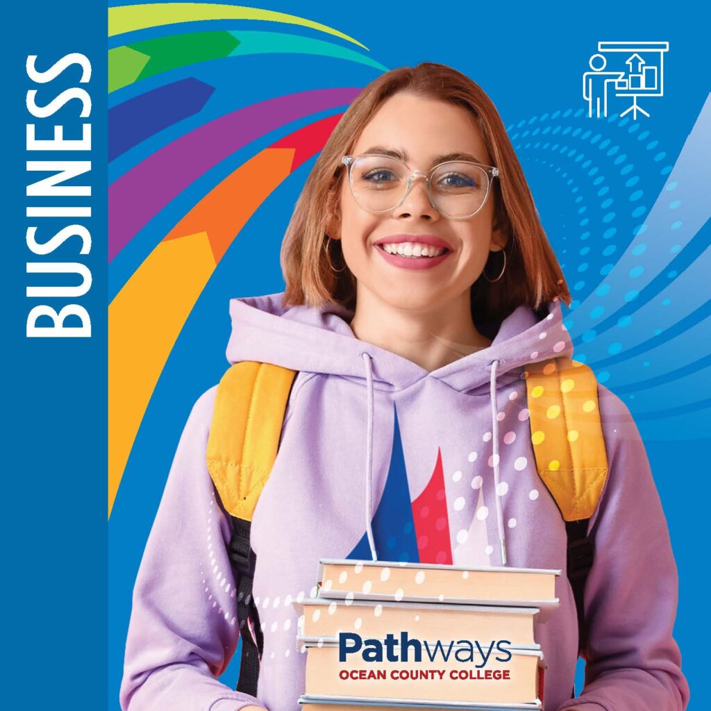 Business with a student holding books that have Ocean County College pathways written on the front