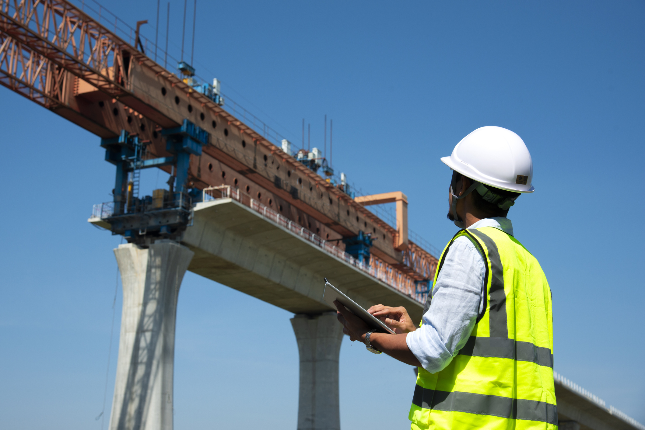 a person inspecting bridge construction