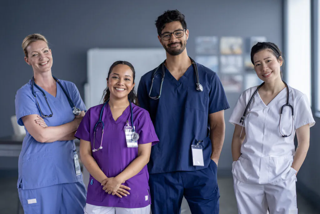A small group of medical professionals pose together