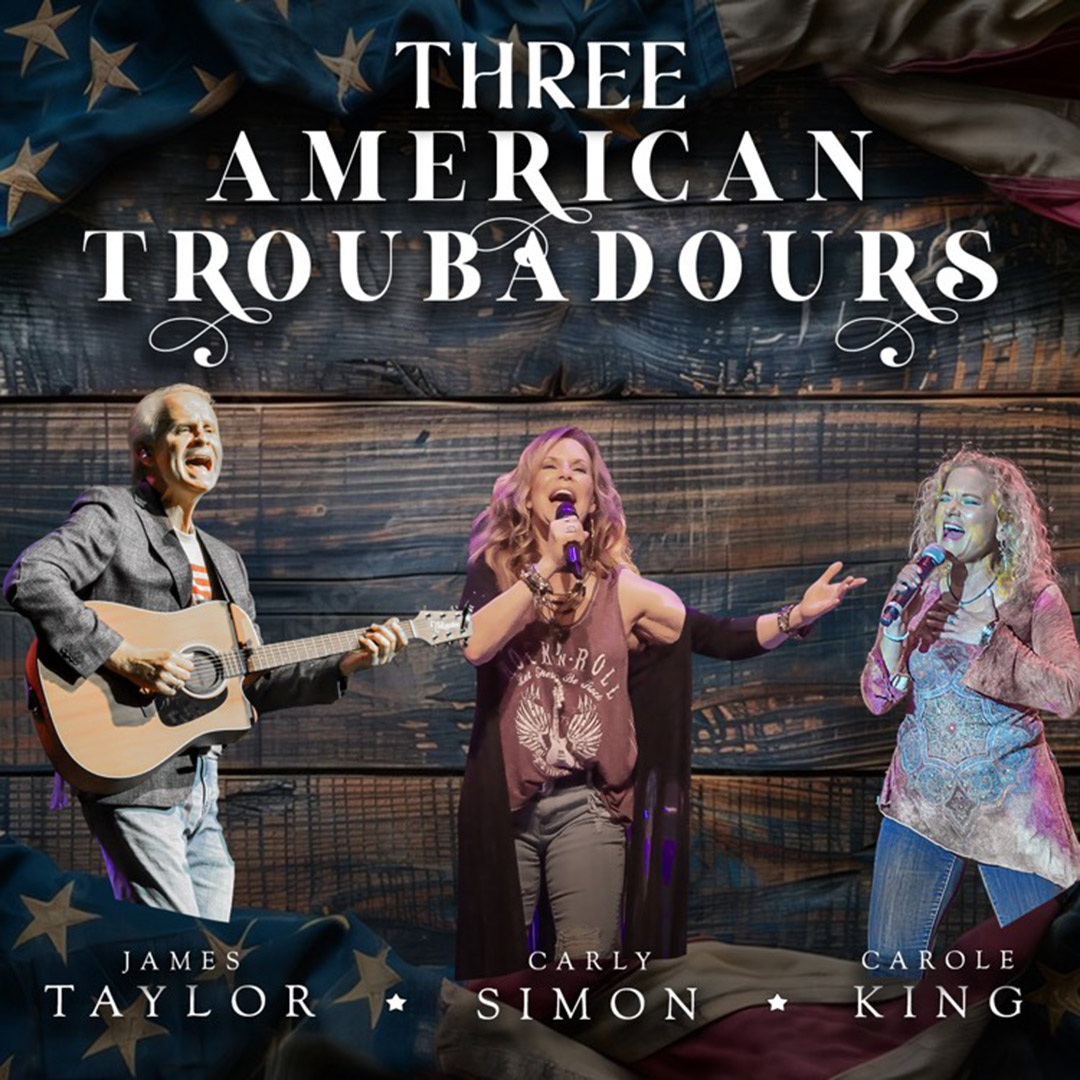 Three people singing in front of a wood panel background