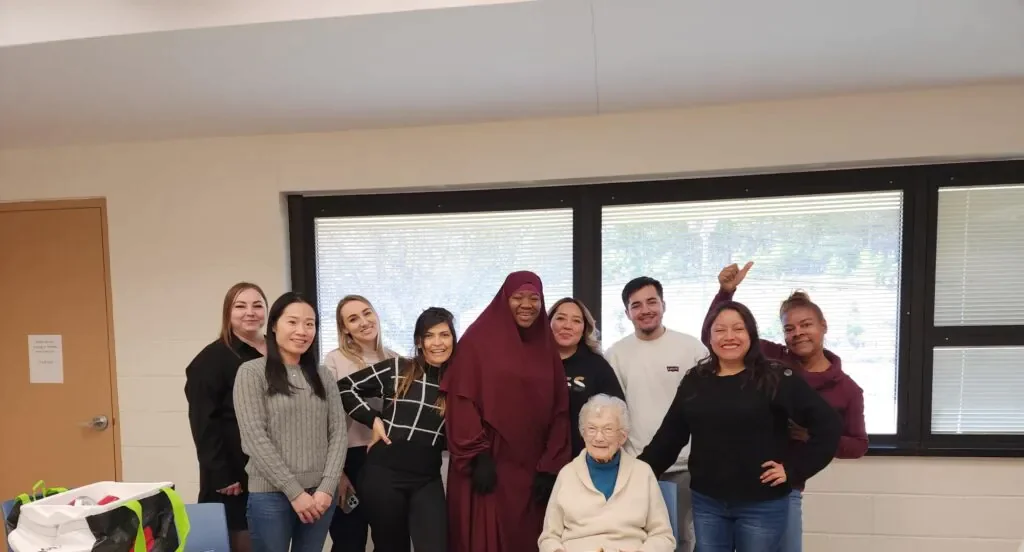 Smiling students in an ESL class