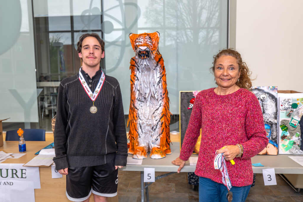 Vincent Tito,  with his artwork “The Tiger”, and Charlotte Langeveld