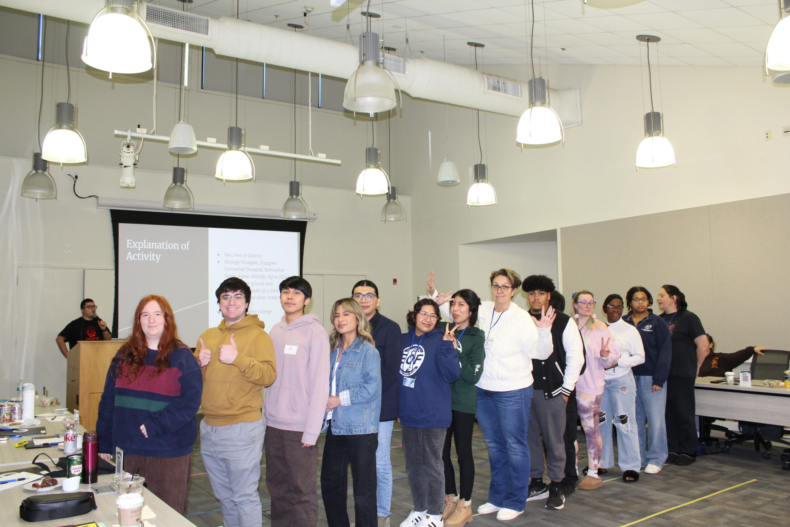 Students standing in a straight line partaking in a group activity called Middle Ground.