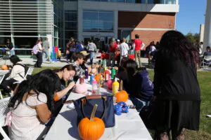 Students decorating pumpkins