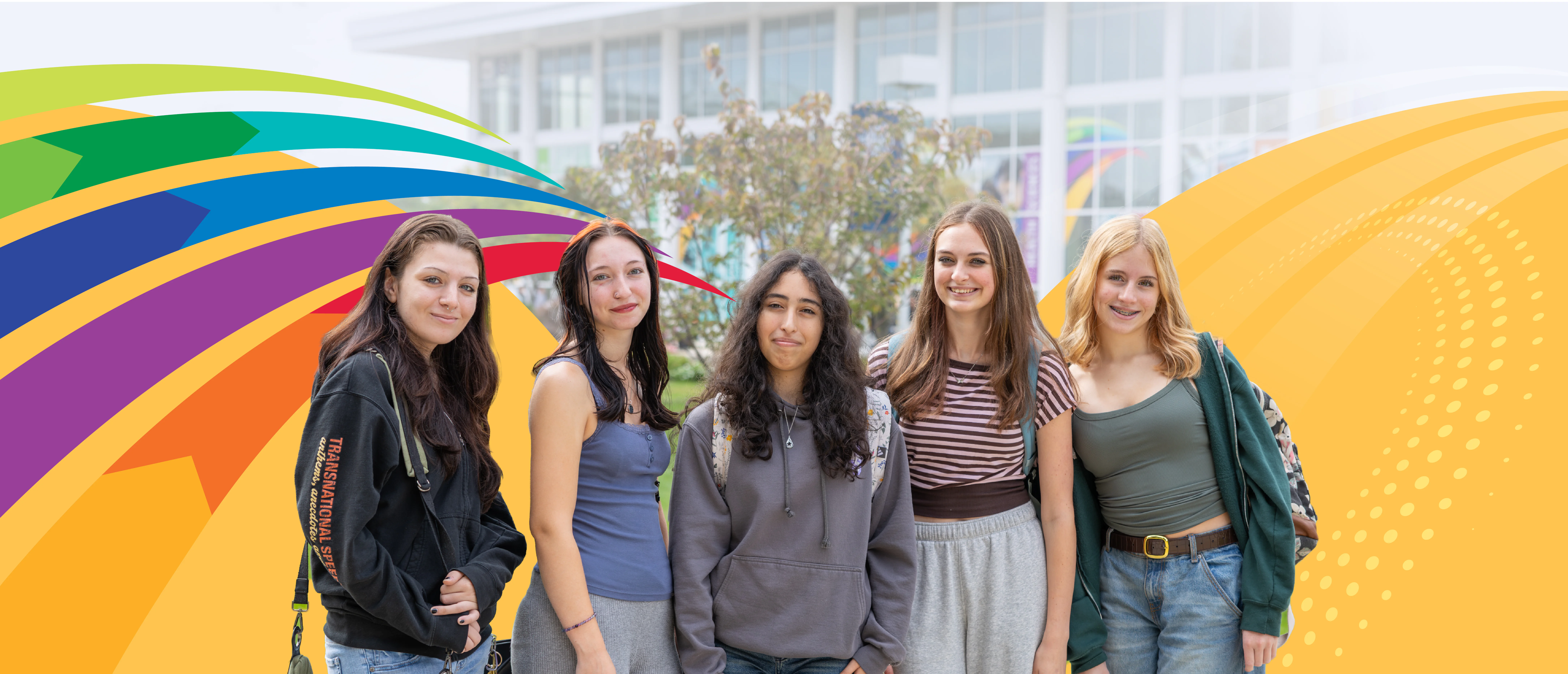 Students on campus with the Instructional Building in the background